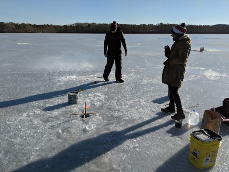 Ice Fishing on frozen pond
